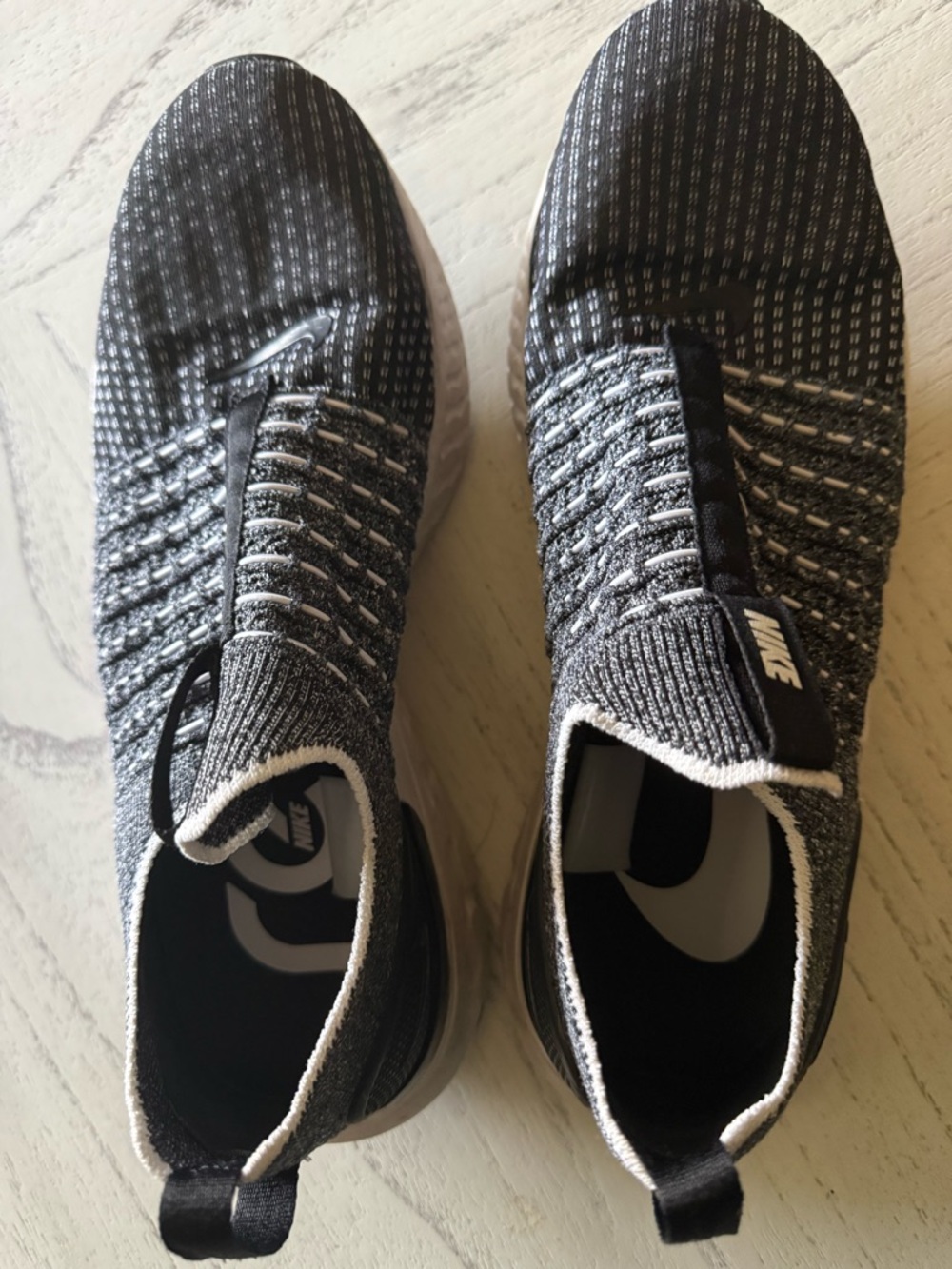 Nike Men’s Black and White Slip-On Knit Athletic Shoes